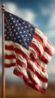 Waving American flag against a blue sky with clouds in the background during a sunny day photo