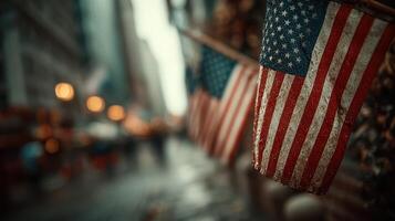American flags adorn the streets of a busy city during a rainy evening, reflecting national pride and urban life photo