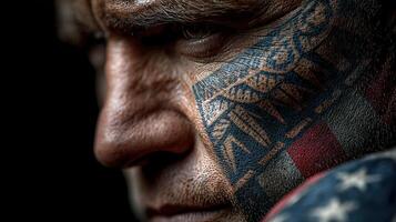 Intense close-up of a tattooed fighter showcasing cultural art and determination ahead of a match photo