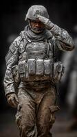 Soldier saluting while wearing military gear in training or deployment setting photo