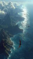 Majestic coastline with flying creatures soaring above the ocean at sunset photo