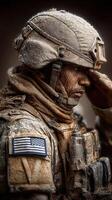 US soldier saluting with respect during a snowy deployment in a rugged environment photo