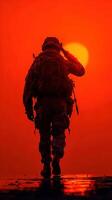 Soldier salutes the setting sun, symbolizing respect and honor during twilight in a military setting photo