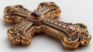 Intricately designed golden cross adorned with jewels displayed against a plain background photo