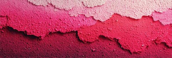 Abstract texture showing vibrant gradient of pink shades with a rough surface at close range photo