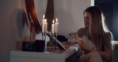 Enjoying a lovely and cozy evening at home surrounded by my cat and the soft light of candles video