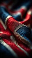 Detailed textile fabric close-up showcasing intricate patterns in red, blue, and silver, emphasizing craftsmanship and design quality photo