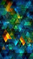 Colorful geometric pattern with triangles creating an abstract design in blue and green tones photo