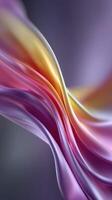 Waves of colorful silk fabric flowing gracefully with a soft blend of purple, pink, and yellow hues in an artistic display photo
