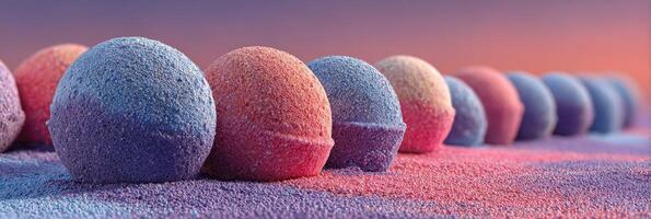 Colorful bath bombs arranged on a surface with a sunset backdrop during a creative product display photo