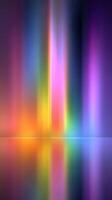 Vibrant colors illuminating the dark background with reflections creating an abstract visual display in a serene setting photo
