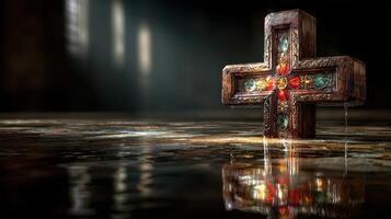 Intricate decorative cross resting on a reflective surface in a dimly lit, historic location showcasing artistry and craftsmanship photo