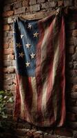 Vintage American flag draped over a rustic brick wall in a cozy indoor setting photo