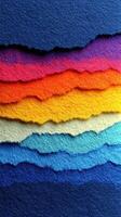 Colorful layers of paper create a vibrant sunset effect with various textured edges and shades photo