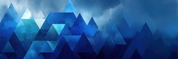 Geometric mountains in deep blue hues with misty clouds creating a serene atmosphere photo