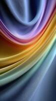 Elegant draped fabric displaying a gradient of colors flowing smoothly from purple to orange and green in soft lighting photo