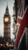 Rainy evening in London with Big Ben and a wet Union Jack flag in focus photo