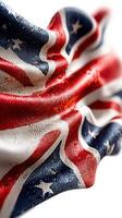 Detailed view of a textured fabric featuring the United Kingdom flag in vibrant colors and intricate folds reflecting light photo