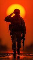 Soldier salutes during sunset in a war zone, symbolizing courage and sacrifice in the face of adversity photo