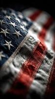 American flag with detailed texture and vibrant colors placed on a dark background, highlighting the fabric and stitching details photo