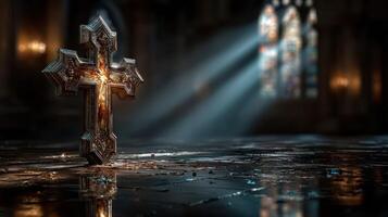 Cross illuminated by sunlight in an ancient, gothic-style church interior photo