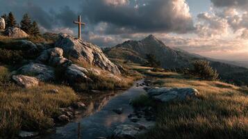 Cross stands on rocky terrain beside a serene stream with mountains in the background during golden hour photo