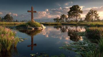 Reflection of a wooden cross in a serene lake surrounded by lush greenery at sunset in a tranquil landscape photo