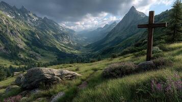 Scenic valley view with a wooden cross amidst lush green hills and mountains under a cloudy sky during the afternoon photo
