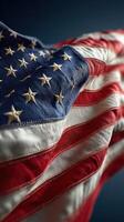 Waving American flag with stars and stripes displayed in detailed close-up under soft lighting photo