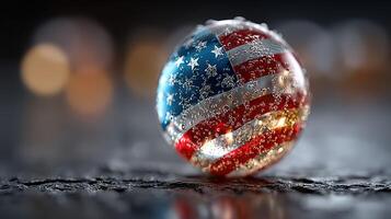 Sphere featuring American flag design surrounded by bubbles on a dark surface at night with soft lights in the background photo