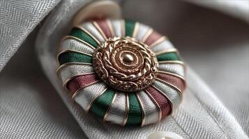 Elegant brooch with intricate design displayed on a formal shirt collar, showcasing craftsmanship and attention to detail photo