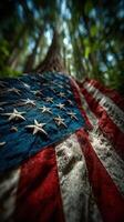 American flag draped on a tree in a serene forest setting during early morning light photo