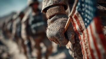 Soldiers display unity and patriotism while lined up in rugged terrain during a military operation in the early morning light photo