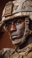 Soldier saluting with determination in a rugged environment during military training photo