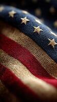 Detail of an American flag fabric showcasing red, white, and blue with stars and stripes in a close-up shot at twilight photo