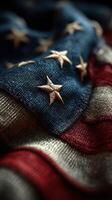 Close-up view of a weathered American flag displaying deep colors and intricate stitching details during a bright afternoon light photo