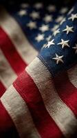 Close-up view of an American flag showcasing its rich textures and colors during a sunny day photo