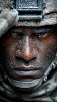 Intense focus of a soldier in combat gear with raindrops on his face during a military training exercise photo
