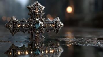 Intricate decorative cross placed on a reflective surface in a dimly lit space photo