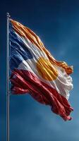Vibrant flag of Colorado waving against a clear blue sky in the bright afternoon light, showcasing its unique colors and design photo