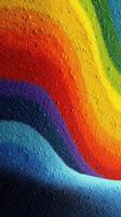 Colorful layers of sand create a vibrant rainbow pattern in an artistic display photo