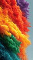 Vibrant explosion of colorful powders creating a stunning visual display in a creative setting during daylight hours photo