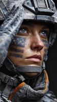 Female soldier saluting with American flag face paint during military training exercise at dawn photo
