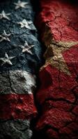 Contrasting textures of torn flags symbolizing the relationship between the United States and China in a cracked surface photo
