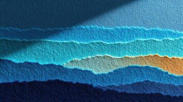 Colorful paper layers create a vibrant abstract landscape with shades of blue, teal, and brown during afternoon light photo
