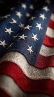 Waving fabric of an American flag displaying stars and stripes with intricate details and rich colors photo
