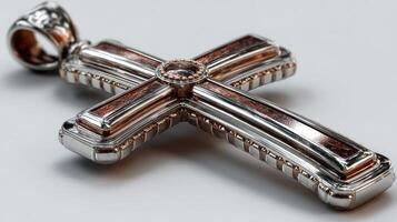 Silver cross pendant with intricate design and rich details crafted for religious significance and personal expression photo