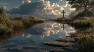 Beautiful reflection of a cross at sunset in a serene landscape with a pond and grassy surroundings photo