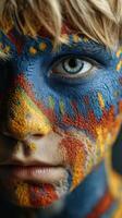 Child with creative face paint in vibrant colors during a cultural event in a lively outdoor setting at sunset photo