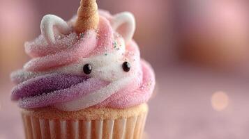 Colorful unicorn cupcake topped with swirl frosting and decorative sprinkles for a festive celebration photo